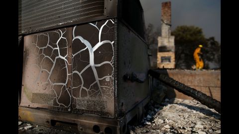 Heat marks are visible on an air-conditioning unit at a destroyed home in Lower Lake on August 1.