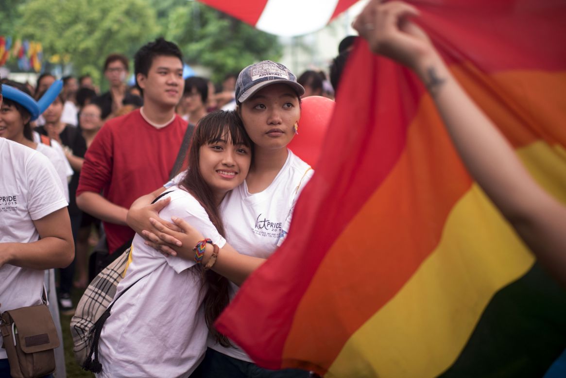 Marchers embrace each other during the pride parade on August 2 in Hanoi.