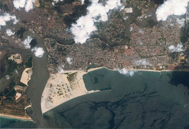<strong>Eko Atlantic, Nigeria</strong> - Eko Atlantic is being constructed on 10 square kilometers of land reclaimed from the Atlantic Ocean, as shown in this satellite image. The developers say a sea wall will protect Eko and nearby Victoria Island from <a href="index.php?page=&url=https%3A%2F%2Fwww.ekoatlantic.com%2Feducation%2Fsea-wall%2F" target="_blank" target="_blank">coastal erosion and storm surges</a>, but critics claim the wall could <a href="index.php?page=&url=https%3A%2F%2Fqz.com%2Fafrica%2F923142%2Fthe-flaw-in-the-construction-of-eko-atlantic-island-in-lagos%2F" target="_blank" target="_blank">worsen</a> conditions for <a href="index.php?page=&url=https%3A%2F%2Fphys.org%2Fnews%2F2019-07-nigeria-lagos-atlantic-erosion.html" target="_blank" target="_blank">neighboring areas</a>.