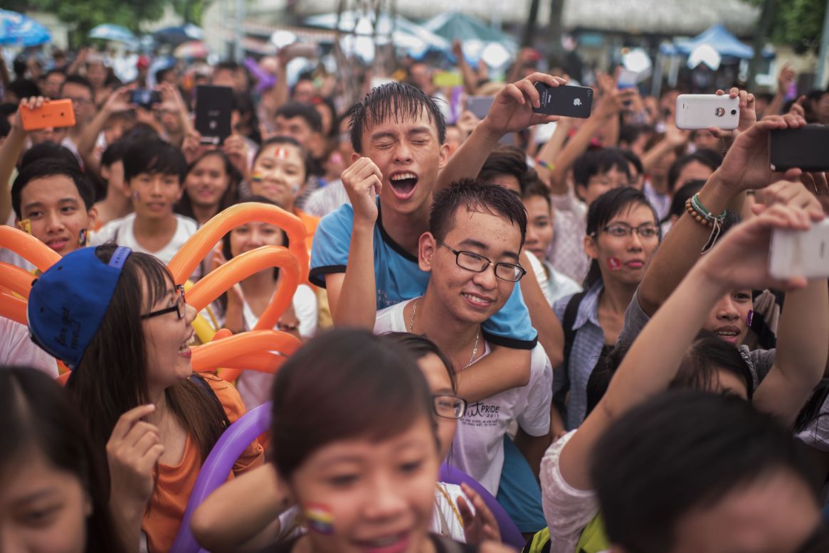 A crowd revel in a performance during the parade on August 2 in Hanoi.