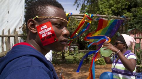 A Ugandan man with a sticker on his face takes part in the annual gay pride in Entebbe, Uganda, on August 9, 2014.