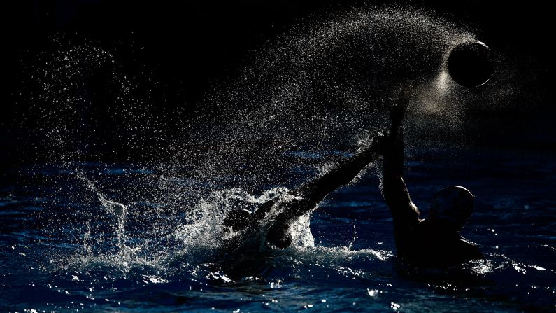 China's Feihu Tan, left, is challenged by Croatia's Maro Jokovic during water polo group play at the World Aquatics Championships on Friday, July 31. The World Championships are being held in Kazan, Russia.