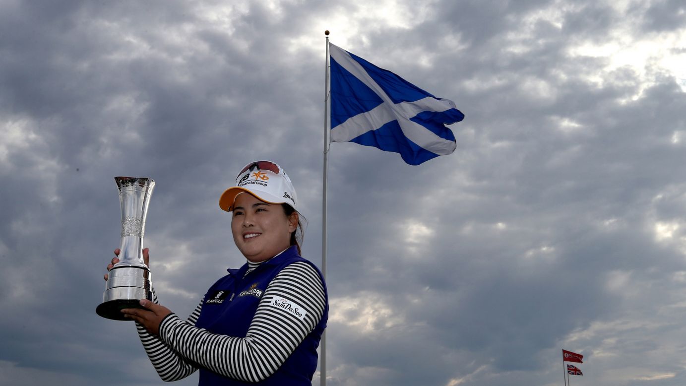 The world's top-ranked women's golfer, Inbee Park, poses with her trophy after winning the Women's British Open in Turnberry, Scotland, on Sunday, August 2. It is her seventh major title.