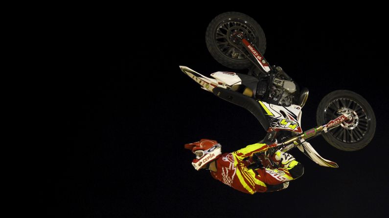Maikel Melero performs a jump during a freestyle motocross show in Malaga, Spain, on Saturday, August 1.