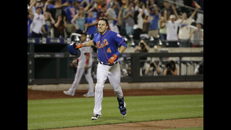 Wilmer Flores tosses his helmet aside after hitting a walk-off home run for the New York Mets on Friday, July 31. <a href="index.php?page=&url=http%3A%2F%2Fwww.cnn.com%2F2015%2F08%2F01%2Fus%2Fwilmer-flores-mets-crying-home-run%2Findex.html" target="_blank">The dramatic game-winner</a> came two days after Flores cried during a game when he thought he had been traded by the Mets.