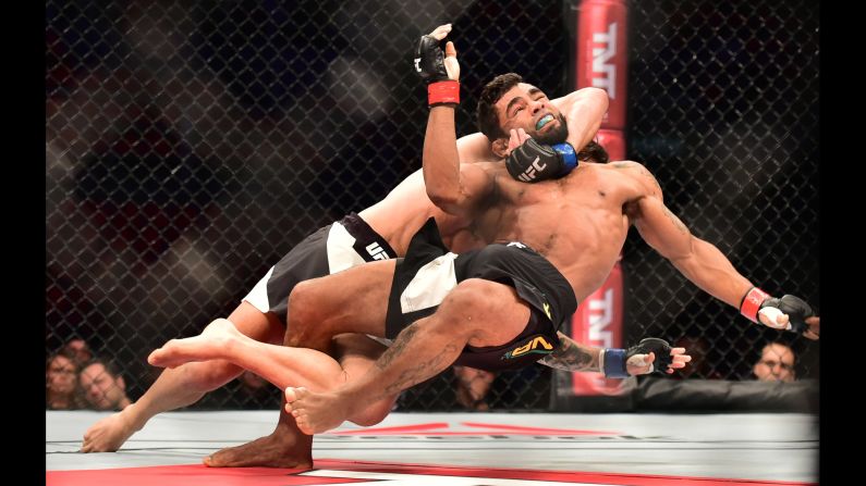Hugo Viana is brought down by Guido Cannetti during their UFC bout in Rio de Janeiro on Saturday, August 1. Cannetti won by unanimous decision.