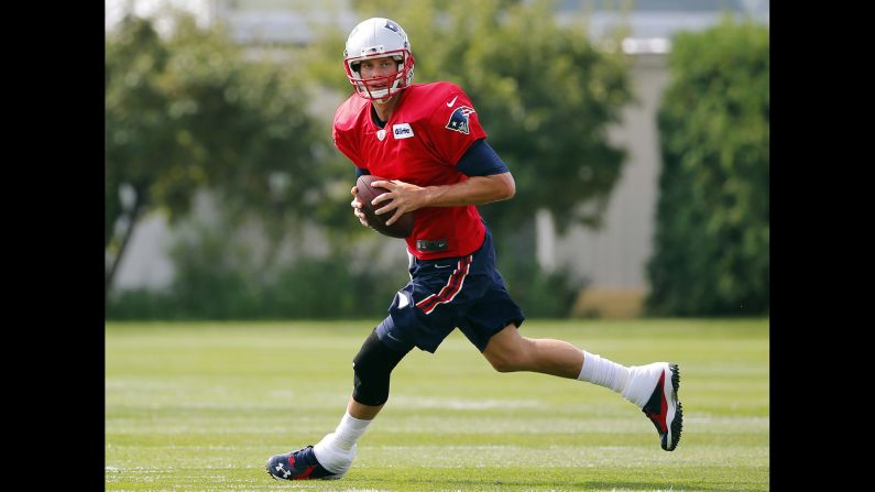New England Patriots quarterback Tom Brady takes part in training camp Thursday, July 30, in Foxborough, Massachusetts. Last year's Super Bowl MVP <a href="index.php?page=&url=http%3A%2F%2Fwww.cnn.com%2F2015%2F07%2F28%2Fus%2Ftom-brady-deflategate-suspension-upheld%2F" target="_blank">is suspended for the first four weeks of the season</a> because of his role in the football-tampering scandal known as "Deflategate," the league announced. Brady has said he did nothing wrong.