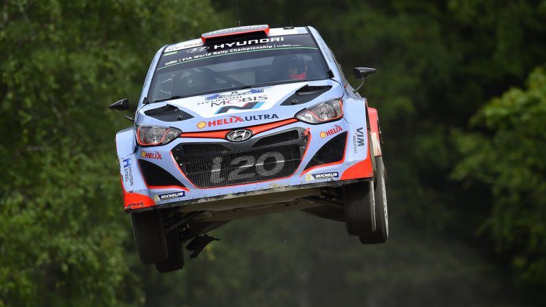 The rally car of Daniel Sordo and Marc Marti goes airborne during a race in Jyvaskyla, Finland, on Friday, July 31.