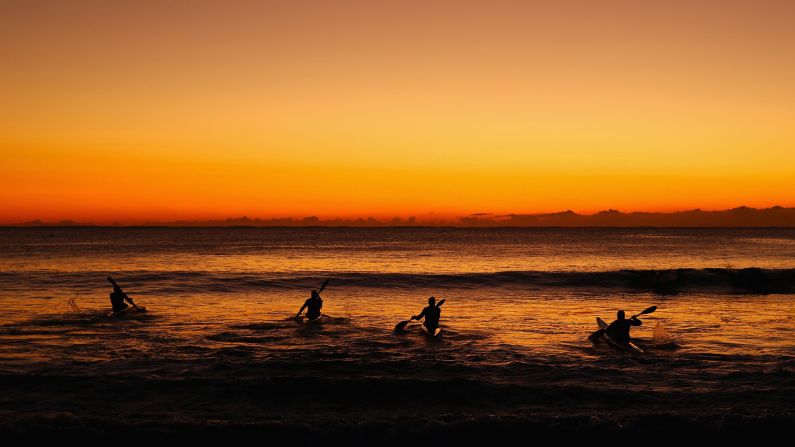 Kayakers train at Sydney's Manly Beach on Tuesday, July 28.