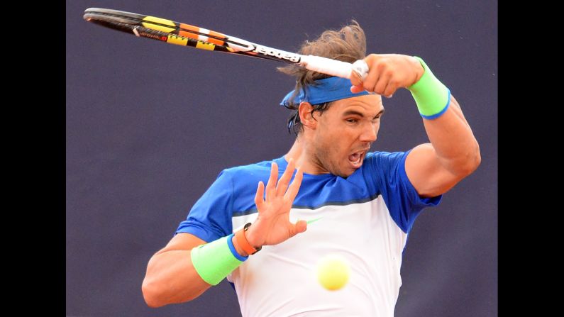 Rafael Nadal hits a shot at the German Open on Thursday, July 30. He won the tournament several days later, defeating Fabio Fognini in the final.