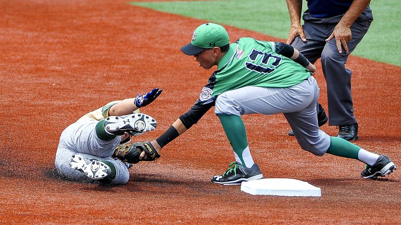 Kainoa Holt tags out Xander Lietz during a youth baseball game played Thursday, July 30, in Aberdeen, Maryland. It was a semifinal game at the Cal Ripken World Series.