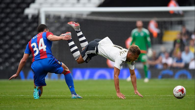 Fulham's Alexander Kacaniklic is upended by Crystal Palace's Martin Kelly during a preseason match in London on Saturday, August 1.