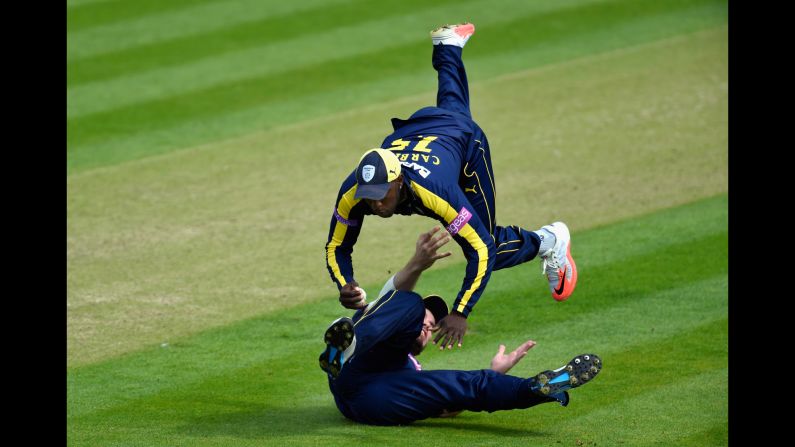 Hampshire fielder Michael Carberry, top, catches a ball to dismiss a Glamorgan batsman during a One-Day Cup cricket match in Cardiff, Wales, on Sunday, August 2. <a href="index.php?page=&url=http%3A%2F%2Fwww.cnn.com%2F2015%2F07%2F28%2Fsport%2Fgallery%2Fwhat-a-shot-sports-0728%2Findex.html" target="_blank">See 37 amazing sports photos from last week </a>
