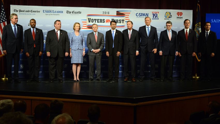 Caption:MANCHESTER, NH - AUGUST 3: (L-R) Former Florida Gov. Jeb Bush, Dr. Ben Carson, New Jersey Gov. Chris Christie, former CEO Hewlett-Packard Carly Fiorina, U.S. Senator Lindsey Graham (SC), Louisiana Gov. Bobby Jindal, Ohio Gov. John Kasich, former New York Gov. George Pataki, former Texas Gov. Rick Perry, former U.S. Senator Rick Santorum (PA), Wisconsin Gov. Scott Walker stand on the stage prior to the Voters First Presidential Forum for Republicans at Saint Anselm College August 3, 2015 in Manchester, New Hampshire. The forum was organized by the New Hampshire Union Leader and C-SPAN in response to the Fox News debate later this week that will limit the candidates to the top 10 Republicans based on nationwide polls. (Photo by Darren McCollester/Getty Images)