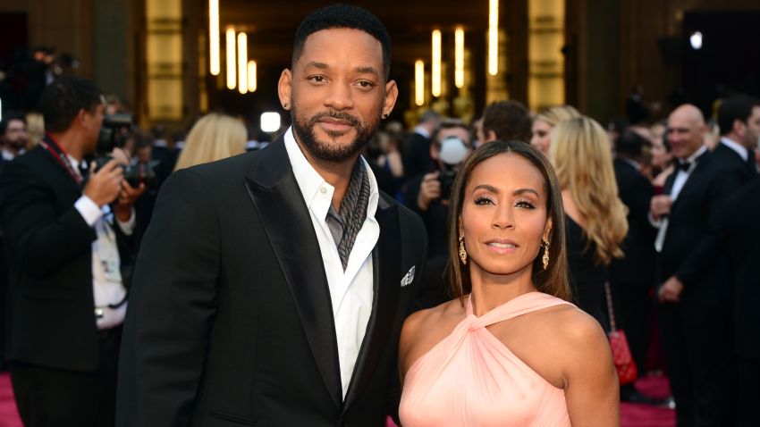 Actor Will Smith and wife Jada Pinkett Smith pose at the 86th Academy Awards in Hollywood, California, on March 2, 2014.