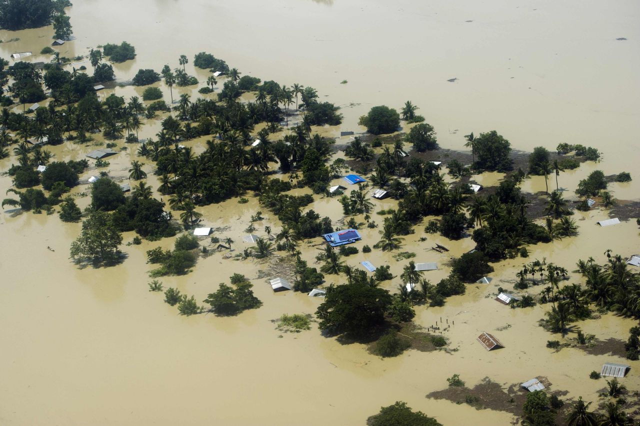Floodwater inundates houses and vegetation in Kalay on August 2. The toll from flash floods and landslides in Myanmar after days of torrential rain is likely to spike, the U.N. warned, as monsoonal downpours continue across the region.