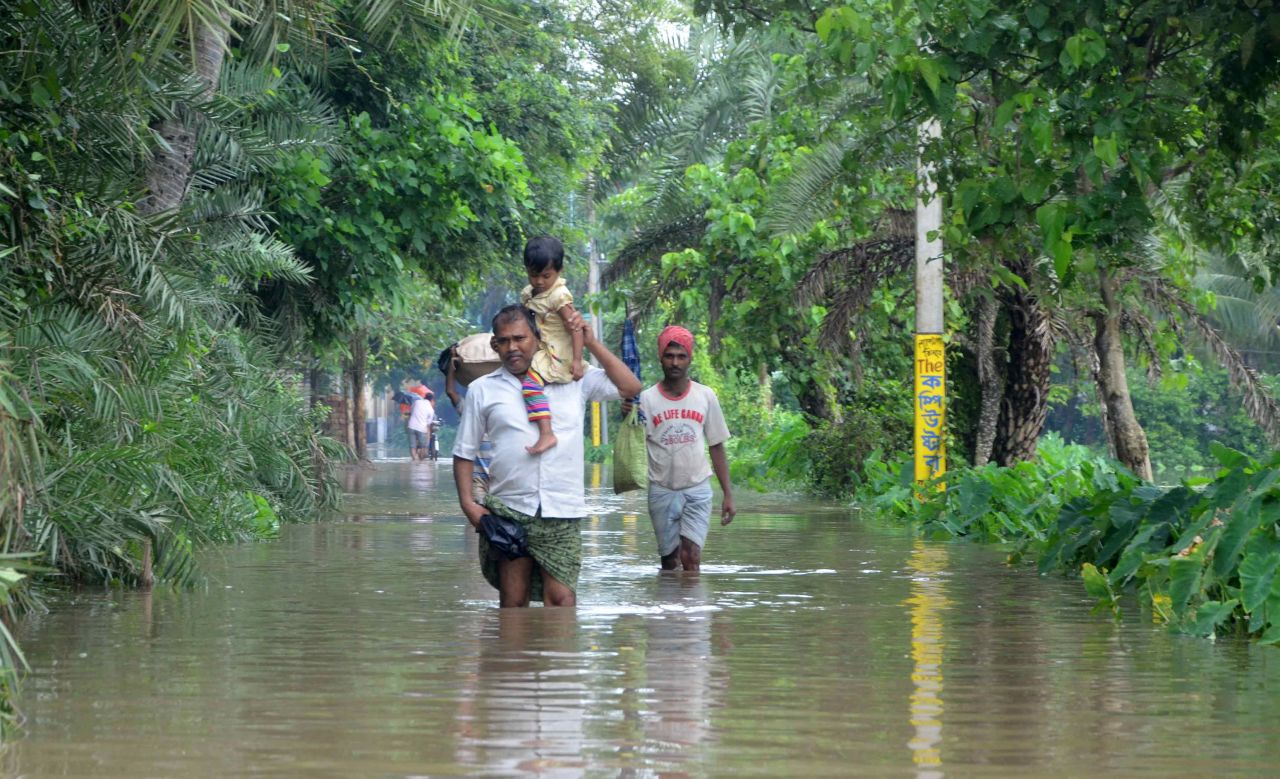 Indian villagers wade through floodwater in Bherampur Block, Murshidabad. In Gujarat, India's westernmost state, 71 people have died. Another 69 have died in West Bengal and 38 have lost their lives in Rajasthan, according to State Home Ministry Spokesman Kuldeep Dhatwalia.
