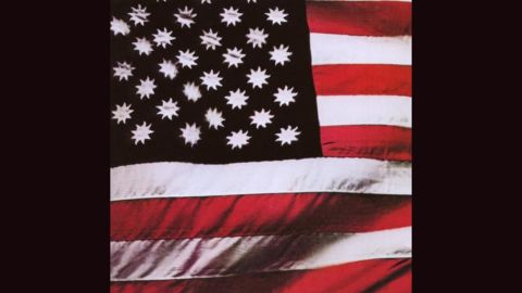 <strong>"There's a Riot Goin' On," Sly and the Family Stone</strong>: Steve Paley's photograph of an American flag with suns in place of stars (on a black field) served as the cover of Sly's 1971 album, but in later years it was replaced by <a href="http://ecx.images-amazon.com/images/I/51jVueymJML._SY300_.jpg" target="_blank" target="_blank">a picture of the band in concert</a>.
