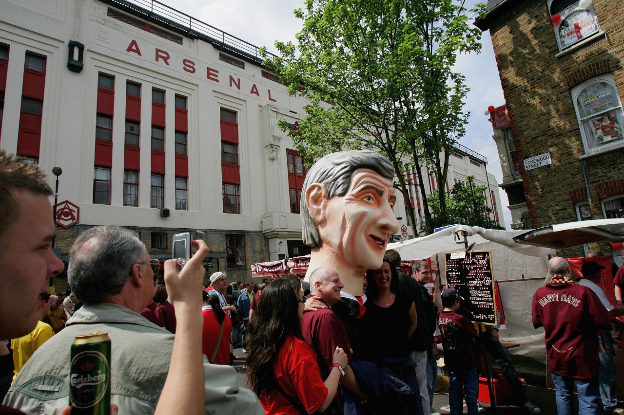 Arsenal fans carry an over-sized replica of Arsene Wenger as they attend the club's final game at Highbury on 7 May 2006. The Gunners beat Wigan 4-2 as Thierry Henry hit a hat-trick. 