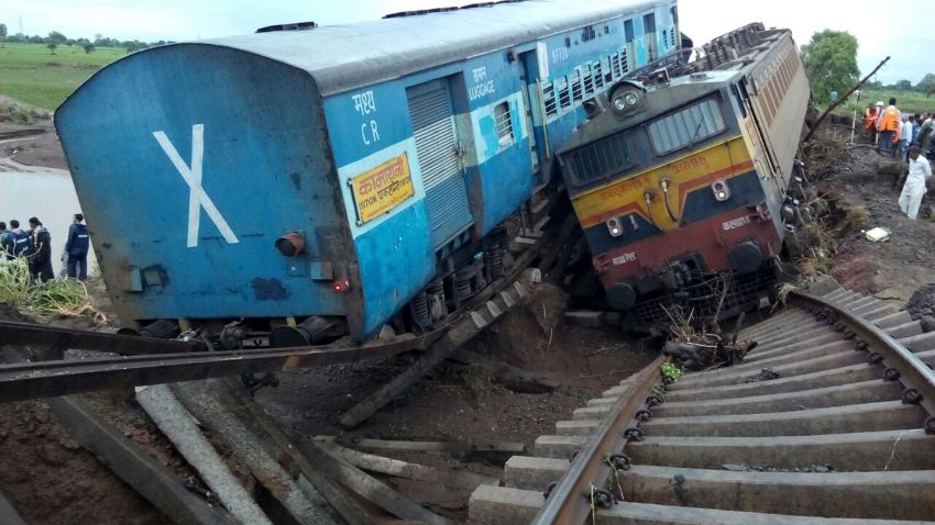 Two passenger trains lay next to each other following a derailment after being hit by flash floods on a bridge in Madhya Pradesh, India, on August 5, 2015.
