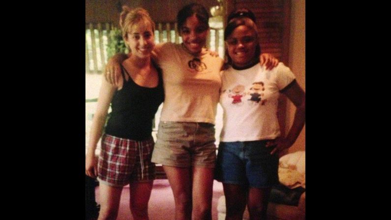 Siha Collins (middle) is pictured here in 1996 in the sixth grade. She was already taller and more developed than her friends.