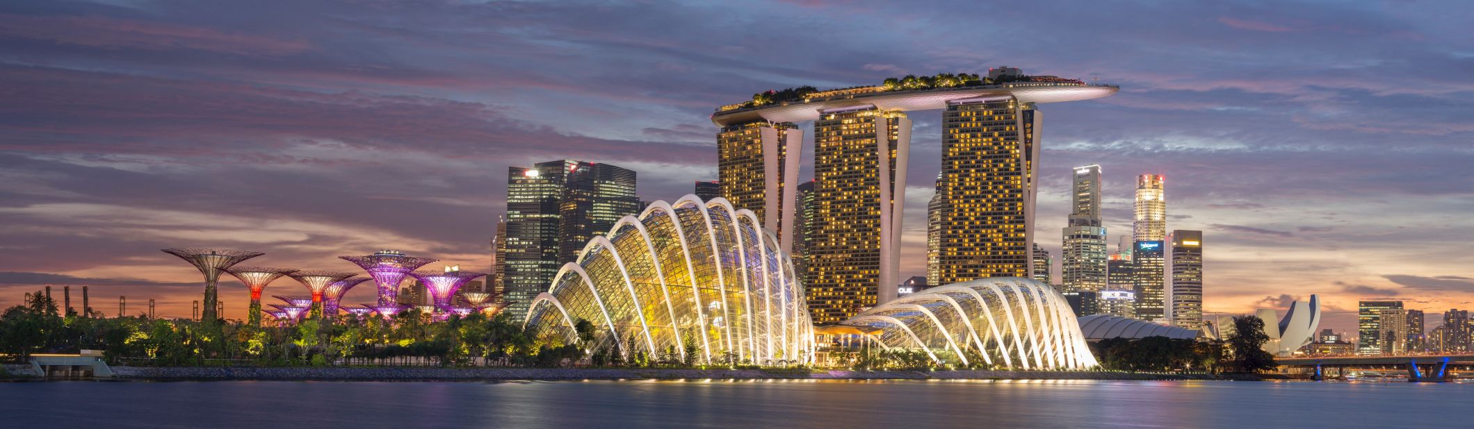 Singapore is home to two of the world's three most expensive buildings (including the three-towered Marina Bay Sands, pictured), a concert hall shaped like a durian and a museum shaped like a robotic hand. 