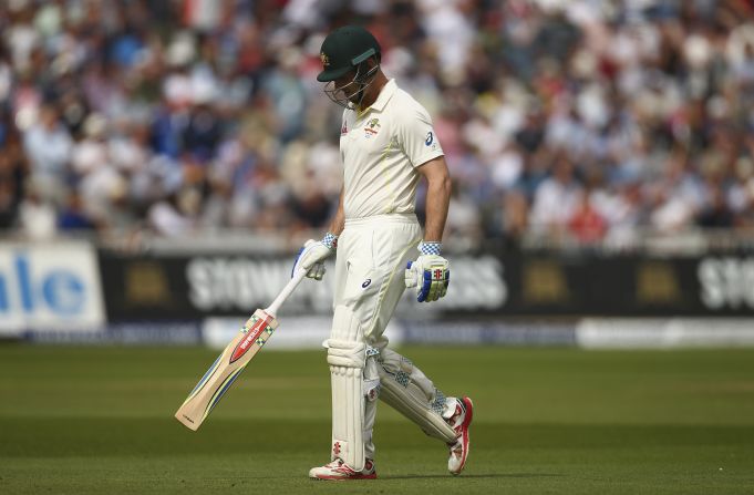 Fourth out: Shaun Marsh of Australia hangs his head after being dismissed by Broad.