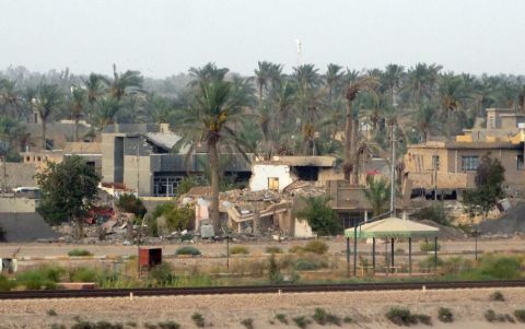 Buildings reduced to piles of debris can be seen in the eastern suburbs of Ramadi on August 6.