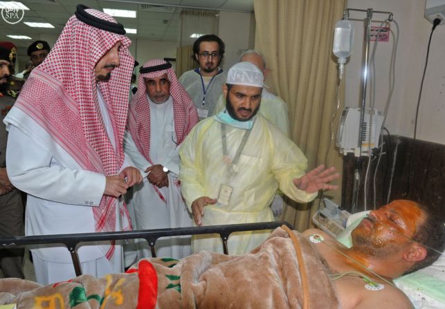 The governor of the Asir region in Saudi Arabia, Prince Faisal bin Khaled bin Abdulaziz, left, visits a man who was wounded in <a href="index.php?page=&url=http%3A%2F%2Fwww.cnn.com%2F2015%2F08%2F06%2Fmiddleeast%2Fsaudi-arabia-mosque-attack%2F" target="_blank">a suicide bombing attack on a mosque</a> in Abha, Saudi Arabia, on August 6. ISIS claimed responsibility for the explosion, which killed at least 13 people and injured nine others.