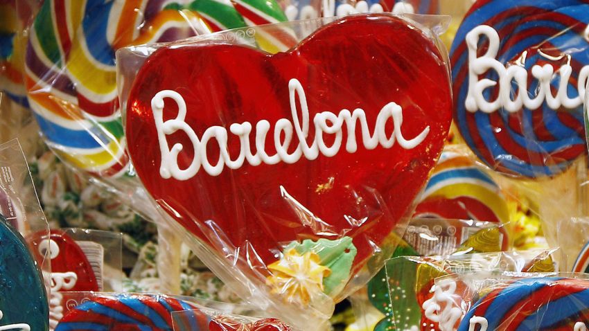 Lollipops with the name of Baecelona on them are displayed for sale at 'La Boqueria' green market in Barcelona on June 29, 2015. Tourists generated 14% of municipal GDP, but these 27 million visitors in Barcelona are a headache for the new mayor Ada Colau , who wants to prevent this Mediterranean port from becoming a theme park. AFP PHOTO / QUIQUE GARCIA TO GO WITH AN AFP STORY BY DANIEL BOSQUE (Photo credit should read QUIQUE GARCIA/AFP/Getty Images)