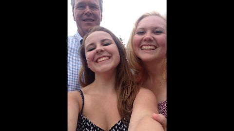 Emma and Addy Nozell with former Florida governor Jeb Bush on July 4 in Amherst, New Hampshire. 