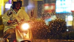 A motorcyclist rides on the street as Typhoon Soudelor approaches eastern Taiwan, in New Taipei City on August 7, 2015. An eight-year-old girl died after being swept out to sea off Taiwan as Typhoon Soudelor bore down on the island, forcing thousands to flee and troops to be placed on standby, officials said. AFP PHOTO / Sam YehSAM YEH/AFP/Getty Images