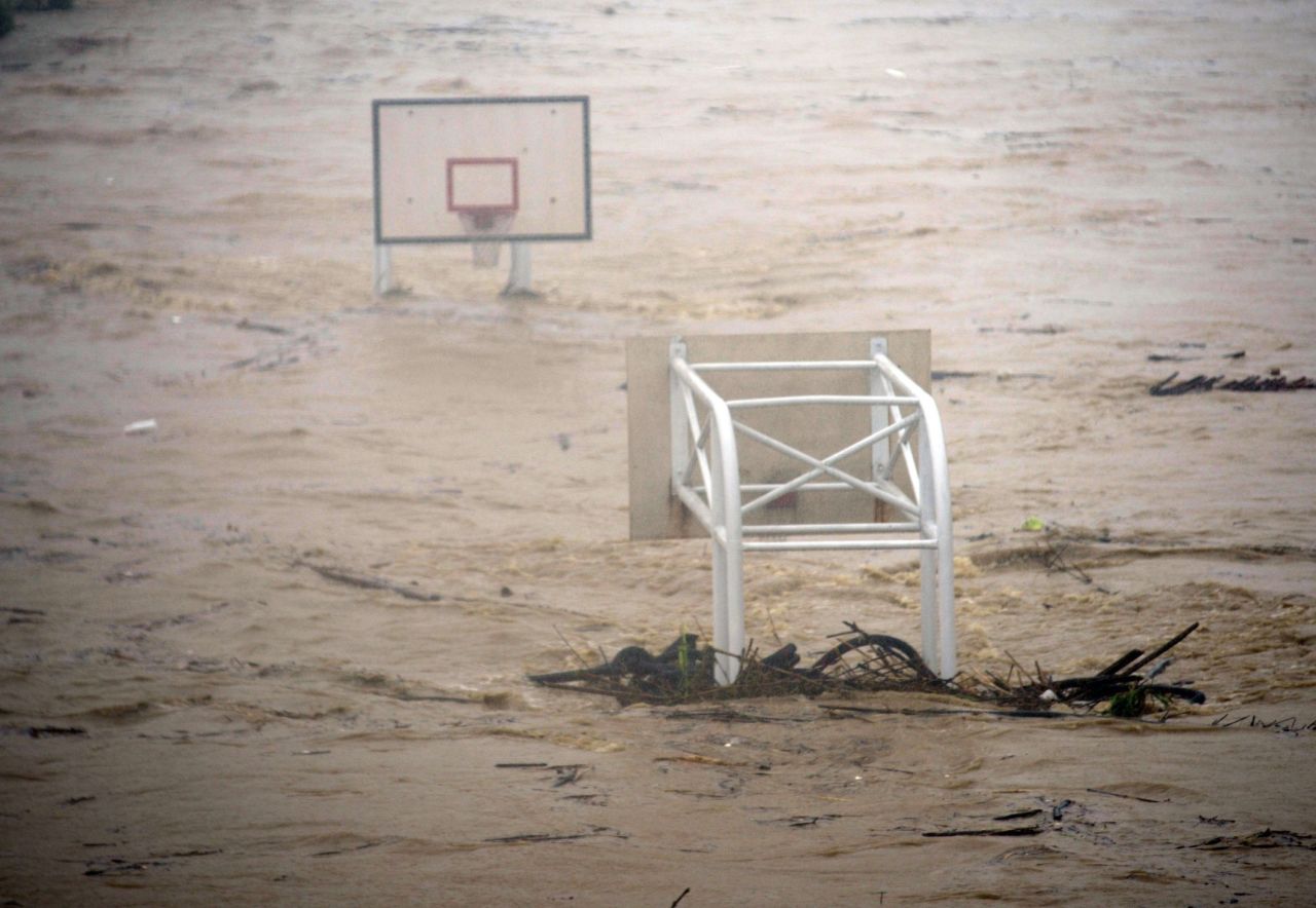 A basket stadium is flooded by the Jingmei River on August 8. More than 3 feet of rain fell in parts of Taiwan Saturday, CNN Meteorologist Ivan Cabrera said.