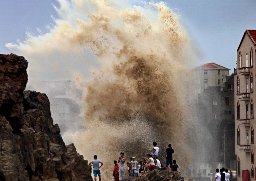 Residents gather to see huge waves stirred up by Typhoon Soudelor in Wenling, China, as the storm draws near the mainland on August 8. 