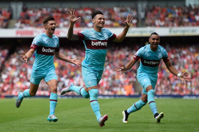 Mauro Zarate celebrates after scoring West Ham's second goal in the 2-0 win over Arsenal at the Emirates.
