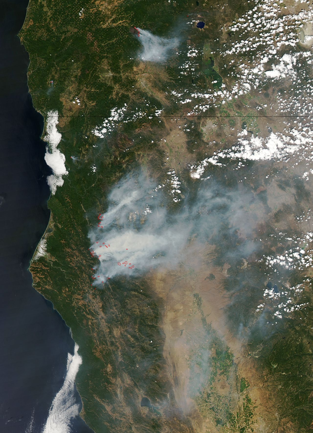 Large wildfires charred more than 6 million acres in the western U.S. in early August  That's nearly 2 million more than the 10-year average. About 80% of the burned area was in remote forests in Alaska, but large fires also scorched parts of Oregon, Washington and northern California. NASA's Aqua satellite took this image of wildfires burning in Oregon and California on August 5. Red outlines indicate the hot spots.