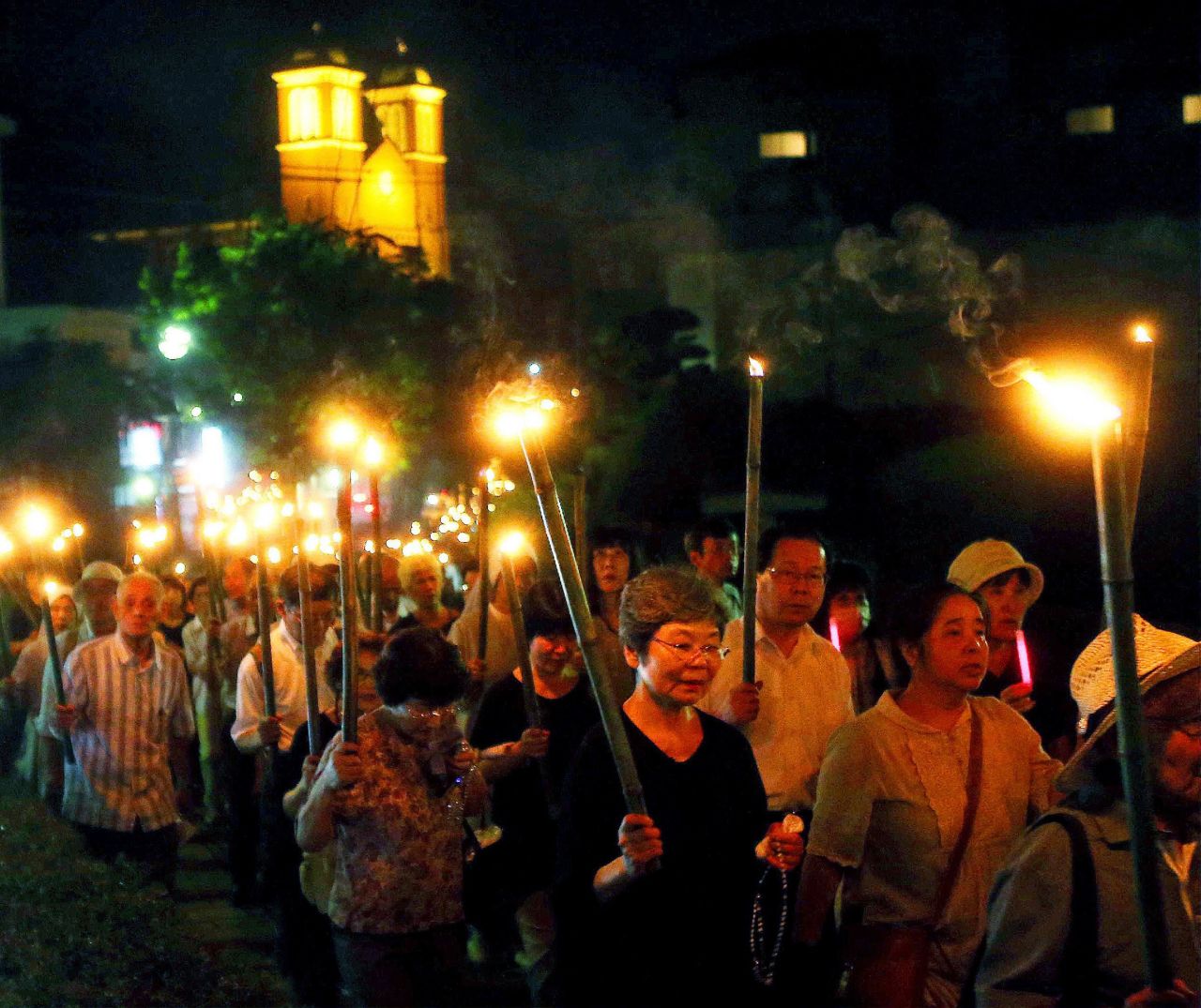 Catholics hold bamboo torches during a peace march from the Urakami Cathedral toward the Peace Memorial park in Nagasaki, Japan, on Sunday, August 9, 2015. Seventy years ago, the United States <a href="http://www.cnn.com/2015/08/04/world/gallery/atomic-bomb-hiroshima-nagasaki/index.html" target="_blank">dropped atomic bombs on the cities of Hiroshima and Nagasaki.</a> The devastation led to Japan's surrender and brought an end to World War II.