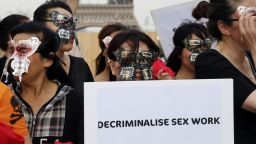 Sex workers take part in a demonstration on June 5, 2015 in Trocadero Square, Paris.