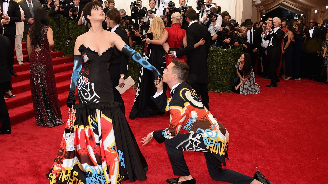 Fashion designer Jeremy Scott kisses singer Katy Perry's hand at the Met Gala in New York back in May.