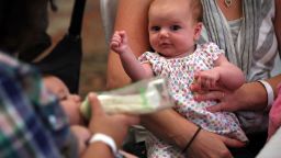SPRINGFIELD, VA - AUGUST 21:  Eight-week-old Eleanor Delp attends a "What to Expect" baby shower with her mother August 21, 2012 in Springfield, Virginia. The DC Metro Chapter of Operation Homefront held the event, with parenting and pregnancy workshops, to celebrate with 100 new and expecting military mothers representing each branch of service from DC, Maryland and Northern Virginia.  (Photo by Alex Wong/Getty Images)