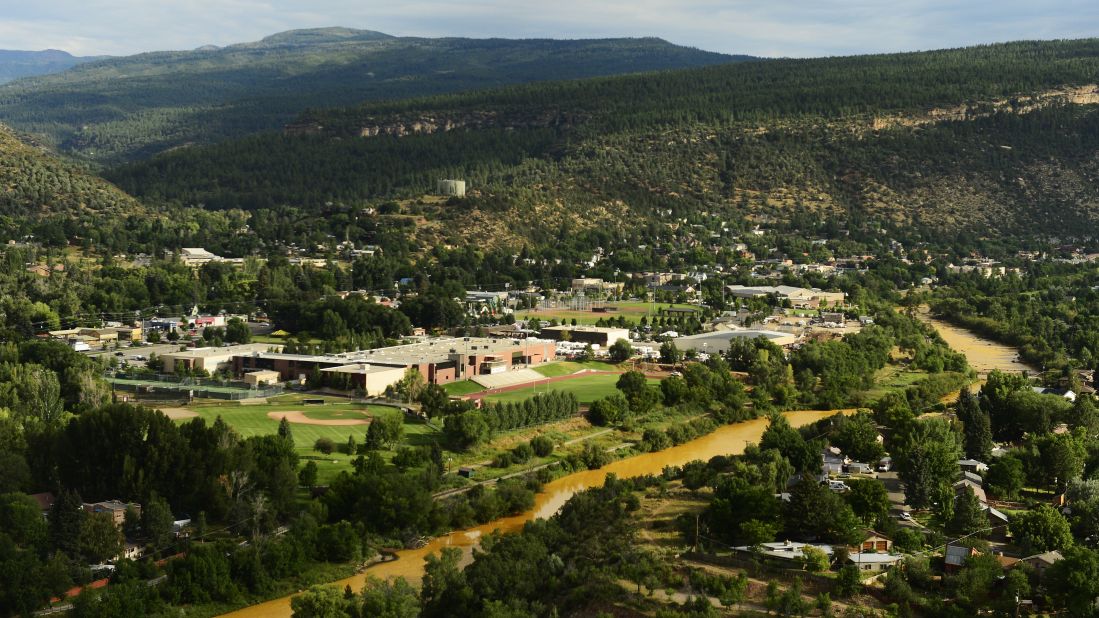 The contaminated Animas River flows through Durango on August 7. Over 2 million gallons of mine wastewater made its way into the river, putting the city on alert. 