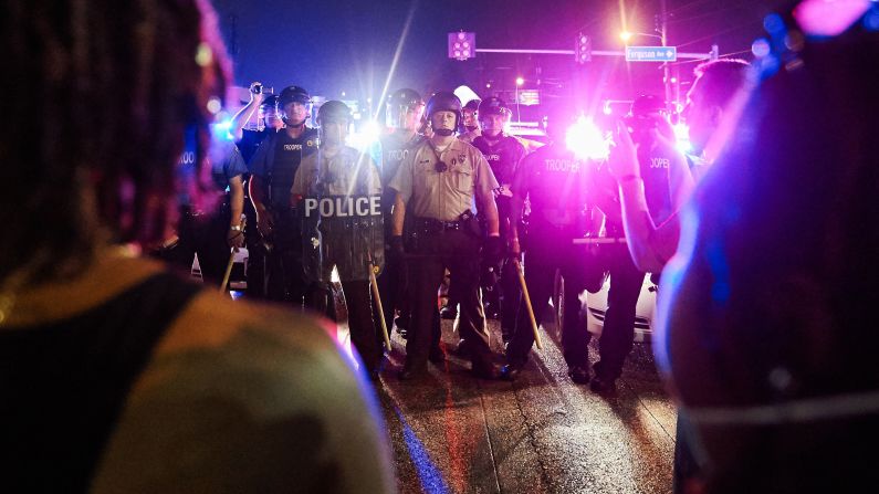Police face off with demonstrators in Ferguson on August 9.