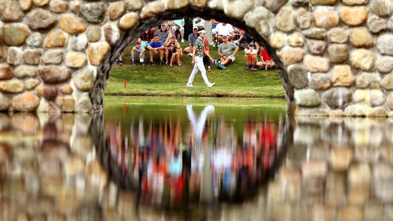 Kevin Na walks to the third green during the third round of the World Golf Championships-Bridgestone Invitational on Saturday, August 8, in Akron, Ohio.  