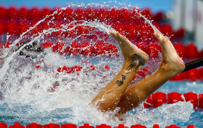 Italy's Federica Pellegrini makes a turn as she competes in the women's 200 meter freestyle preliminaries at the Aquatics World Championships in Kazan, Russia, on Tuesday, August 4. 
