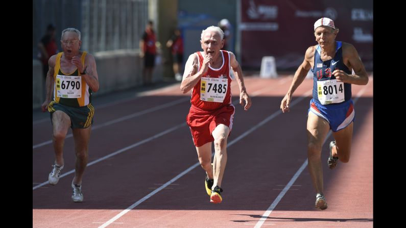 Switzerland's Hans Bloechlinger center, South Africa's Monty Hacker, left, and American Dick Richards run during the men's 80-years-old 100 meter final at the World Masters Athletics Championship on Friday, August 7, in Lyon, France.  