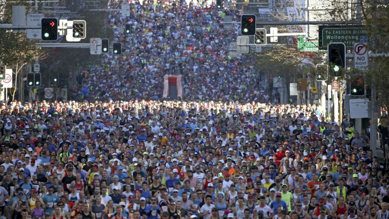 Competitors race along William Street during the start of the City2Surf fun run in Sydney on Sunday, August 9. 