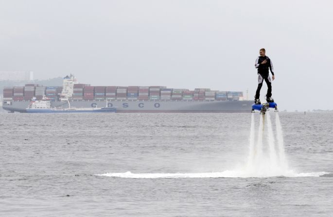A performer rides a flyboard as part of a local cultural and sports festival in Vladivostok, Russia, on Friday, August 7.