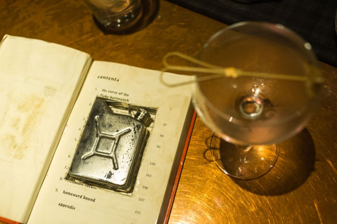 "Robin Hood Roy," a signature cocktail at Flask, comes in a petrol-can-shaped flask hidden inside a book. 