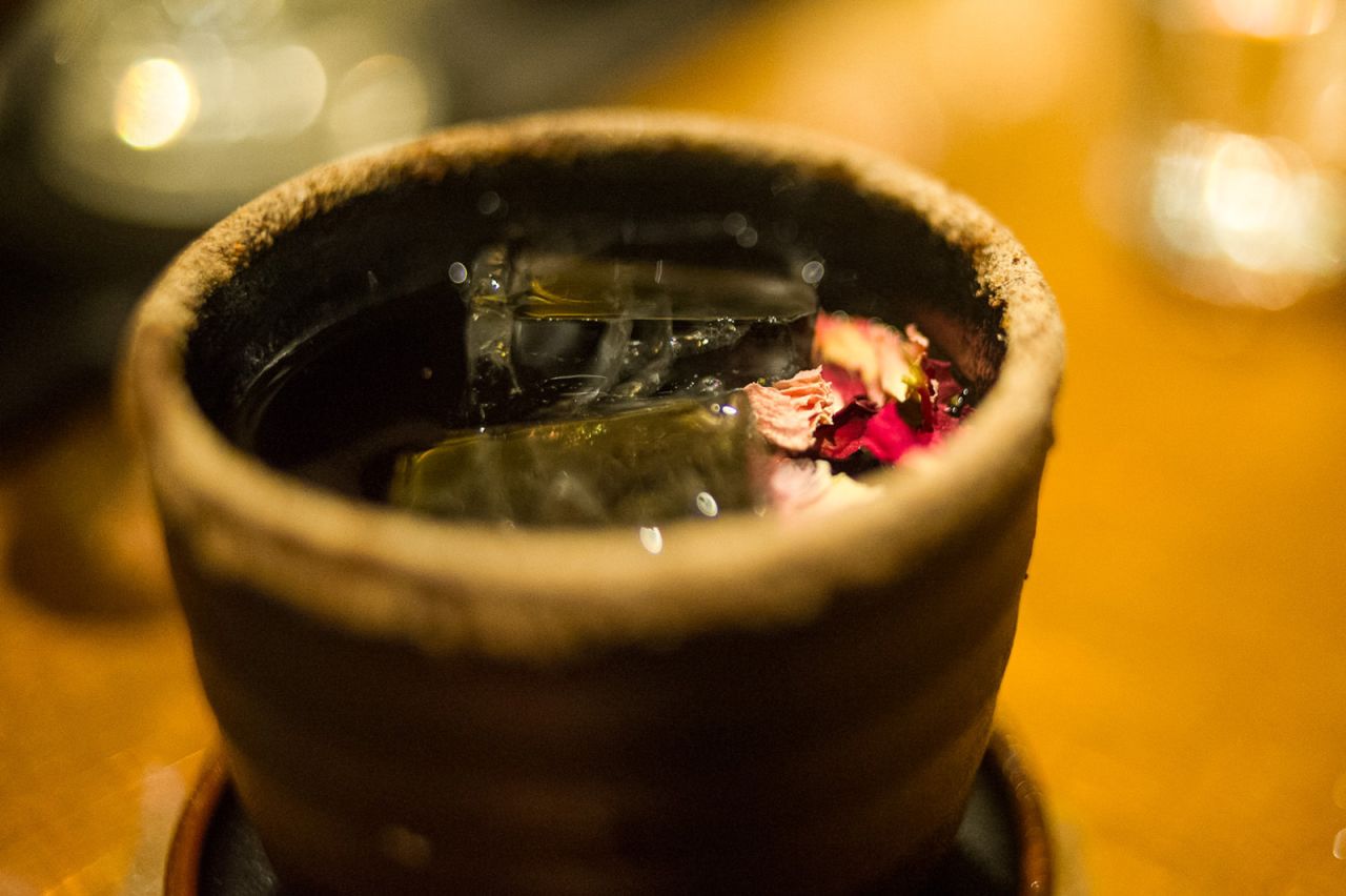 Taiwan Plum Soup features Zacapa rum, an infusion of longan juice, sherry and creme de cassis, Prucia plum liqueur, sweet osmanthus wine, dried chrysanthemum flowers and a dusting of salty plum sugar on the rim of an earthenware cup.