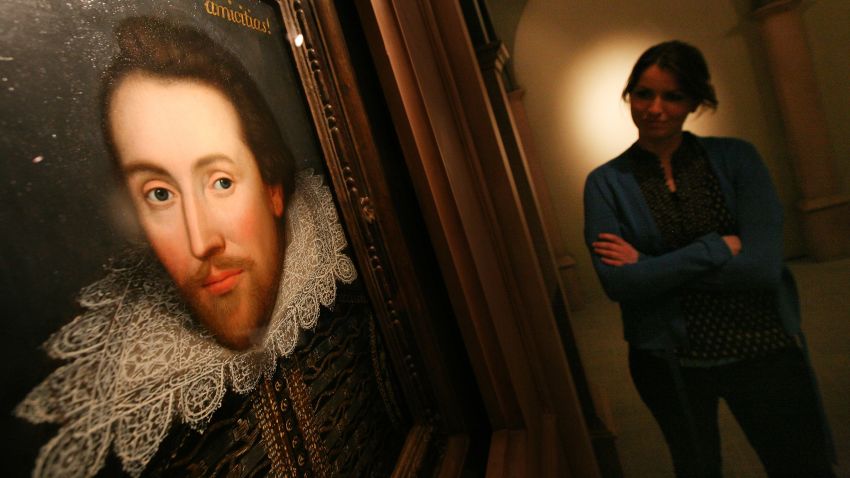 STRATFORD-UPON-AVON, ENGLAND - APRIL 17:  An employee of The The Shakespeare Birthplace Trust poses with a portrait of William Shalespeare on April 17, 2009 in Stratford-upon-Avon, England. The recently discovered painting, which is believed to date from around 1610, depicts Shakespeare in his mid-forties, and is believed to be the only authentic image of Shakespeare made during his life.  (Photo by Dan Kitwood/Getty Images)